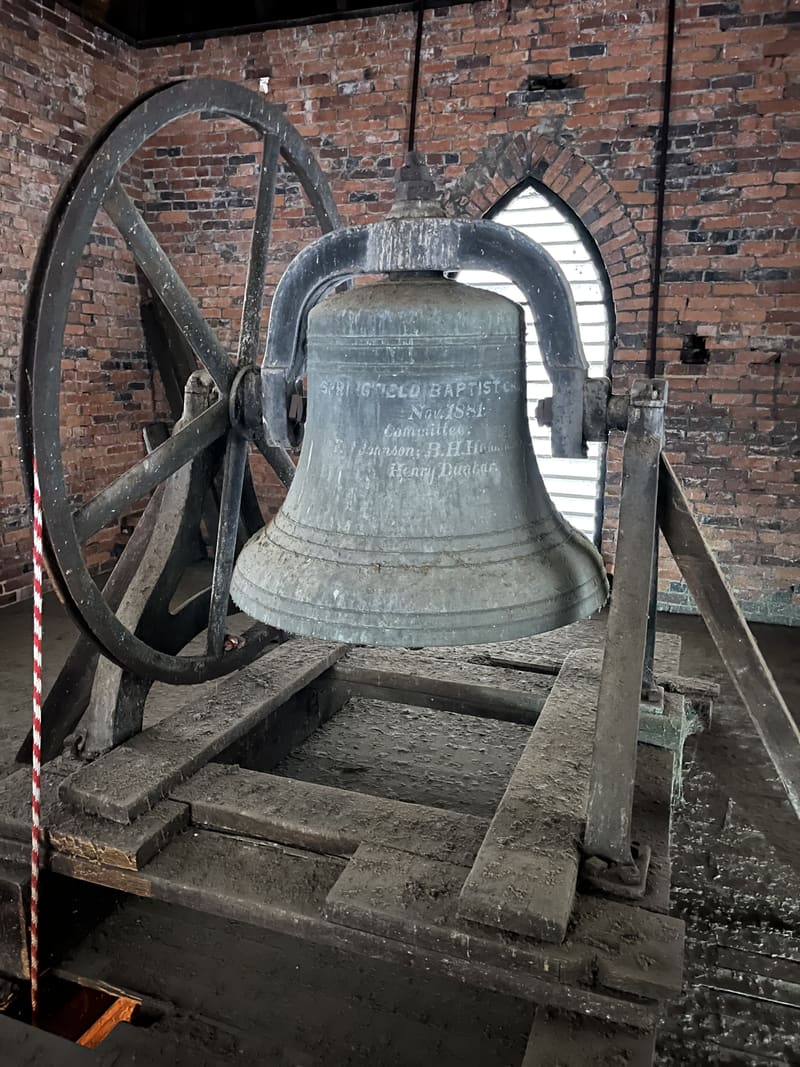 The bell and its wheel in the tower before restoration