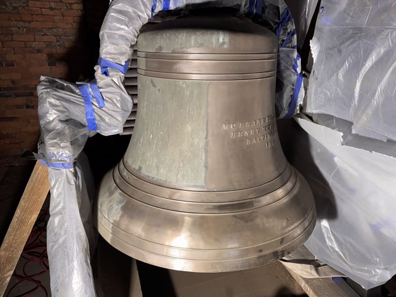 The bell wrapped and taped during restoration work