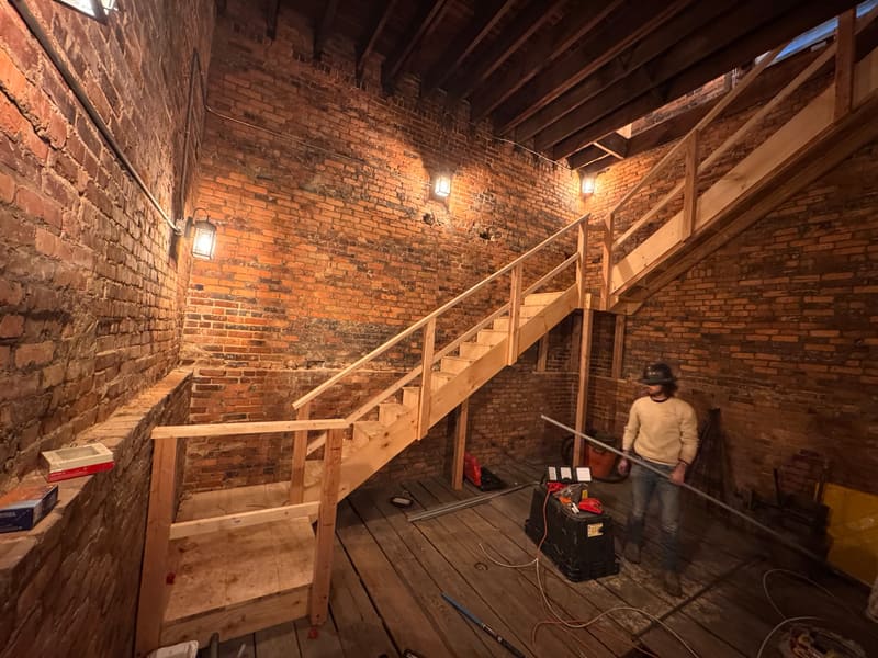 MPC crew building the new timber stair and framing inside the bell tower