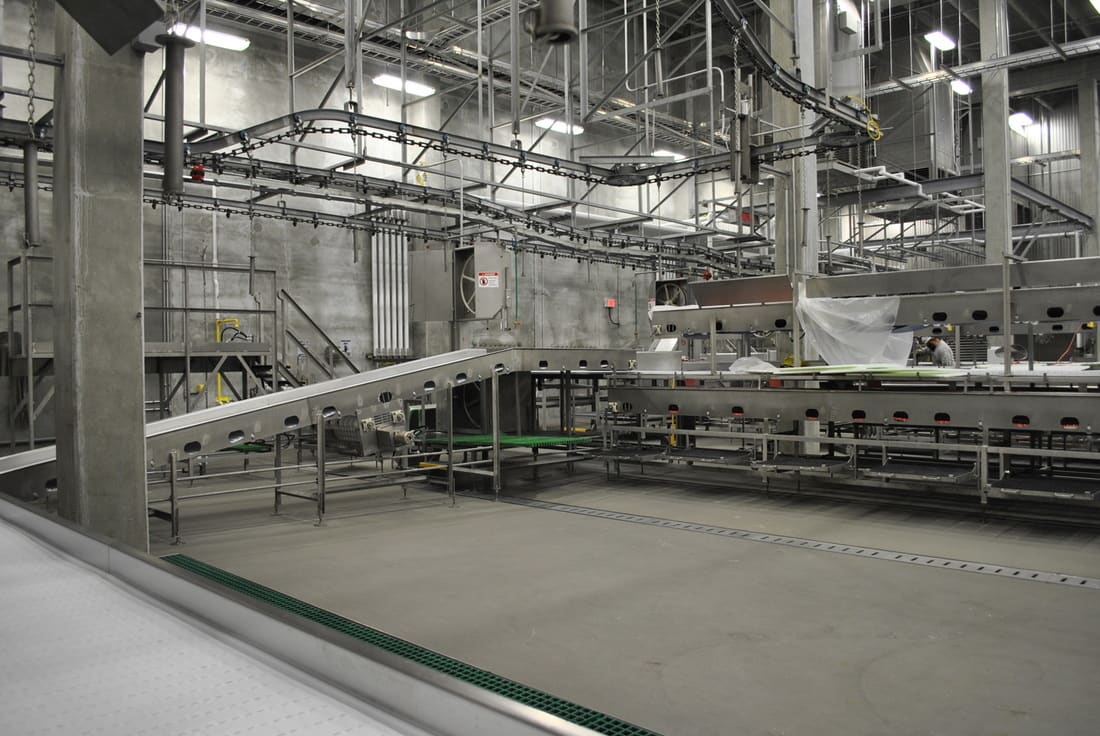 Overhead rail systems on a harvest floor