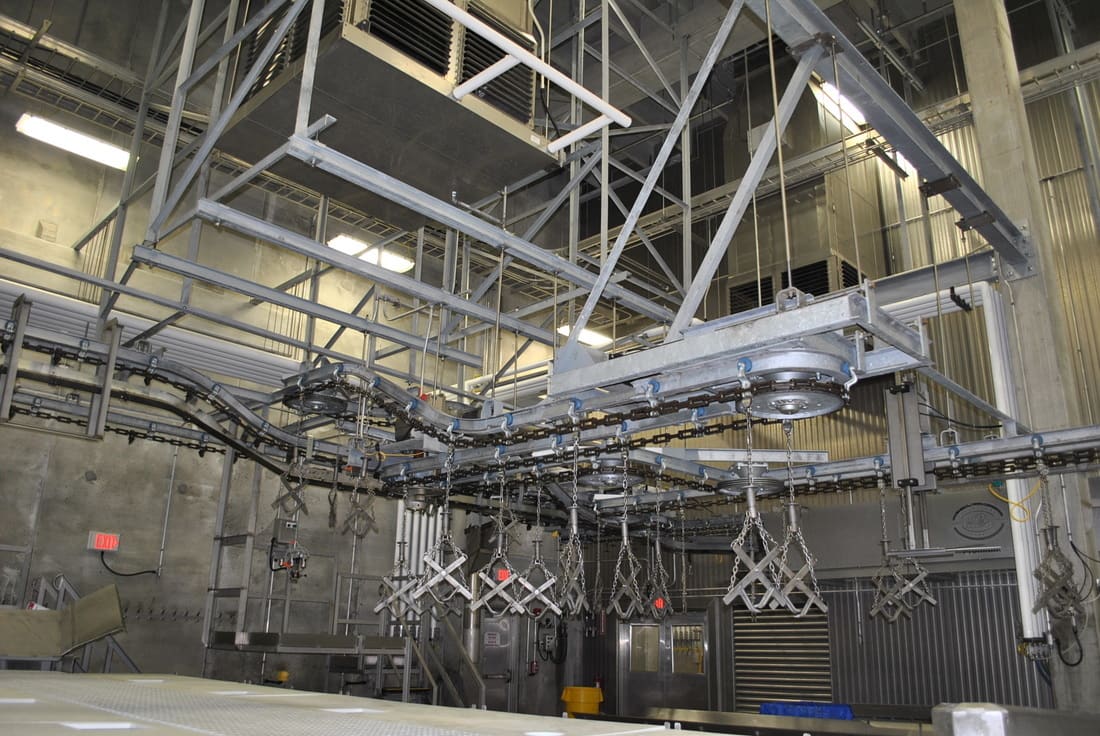 Overhead rail installation on a harvest floor